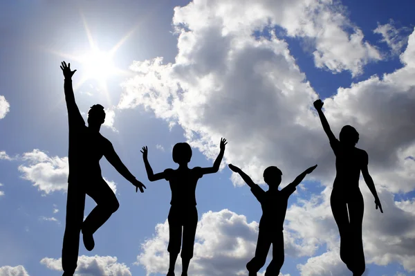 Jump family of four on sky — Stock Photo, Image