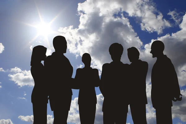 Business silhouette on sunny sky — Stock Photo, Image