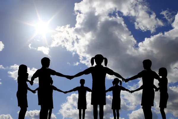 Children circle on real sunny sky — Stock Photo, Image