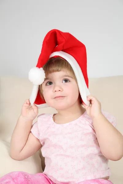 Kind in de kerstman hoed — Stockfoto