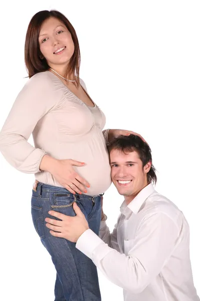 Мужчина и беременная девушка. listenning to ... — стоковое фото