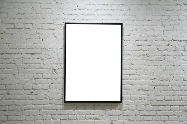 Uma moldura preta na parede de tijolo branco — Fotografia de Stock