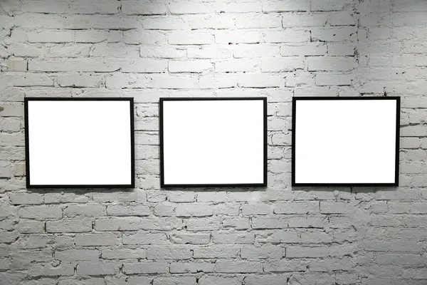 Black frames on white brick wall 2 — Stock Photo, Image