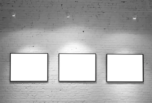 Three frames on brick white wall — Stock Photo, Image