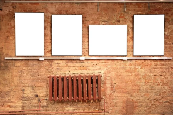 Frames on red brick wall — Stock Photo, Image