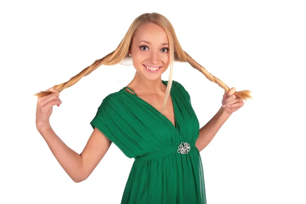 Girl in green holding plaits — Stock Photo, Image
