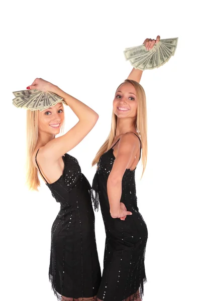 Meninas gêmeas balançar dólares — Fotografia de Stock