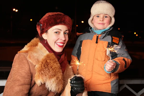 Mother and son with sparklers — Stock Photo, Image