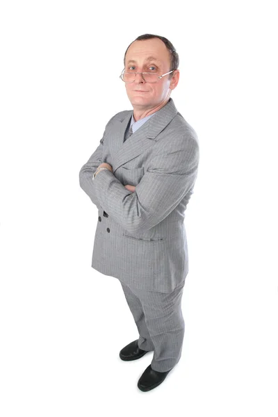 Muž v šedém obleku pózuje — Stock fotografie