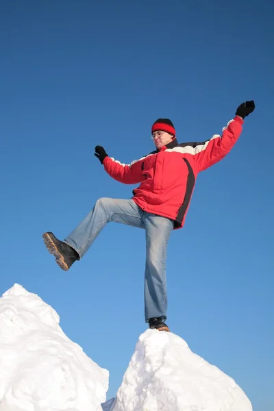 Man steps from one snowy chunk to another — Stock Photo, Image