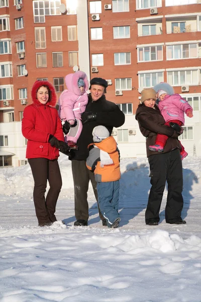 Two yuong woman and grandfather with children on the walk in the winter — Stock Photo, Image