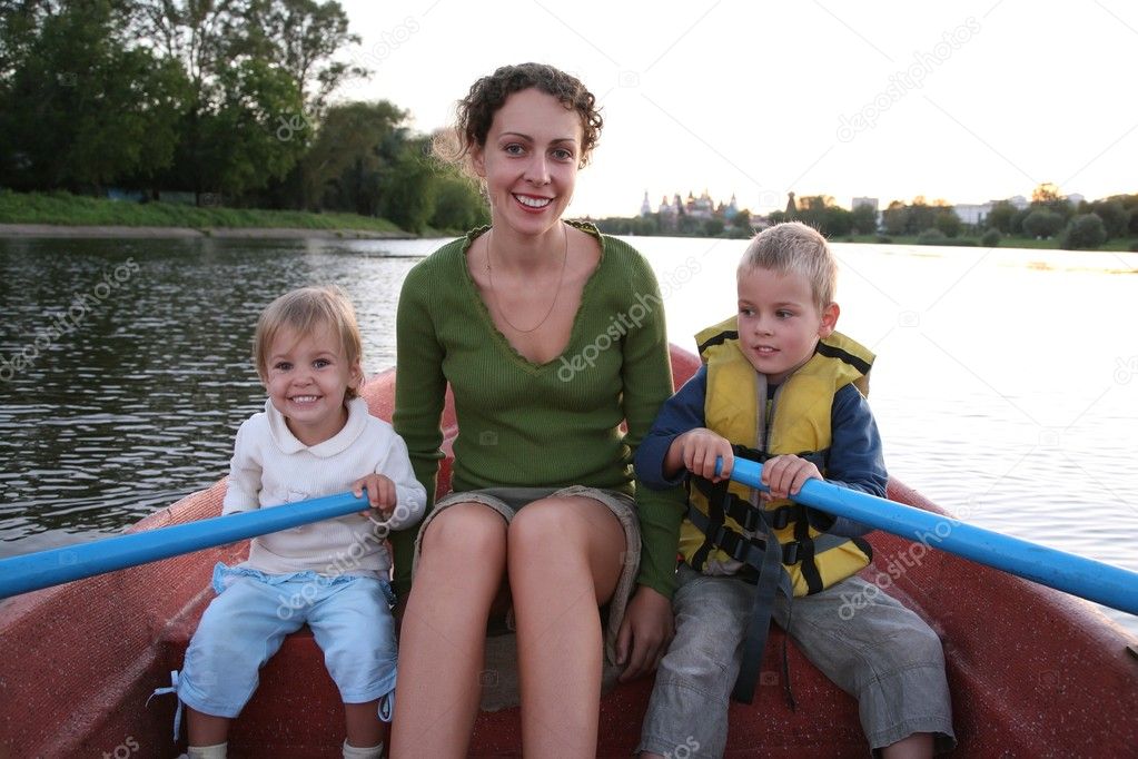 Mother and child in the boat in the lake 2