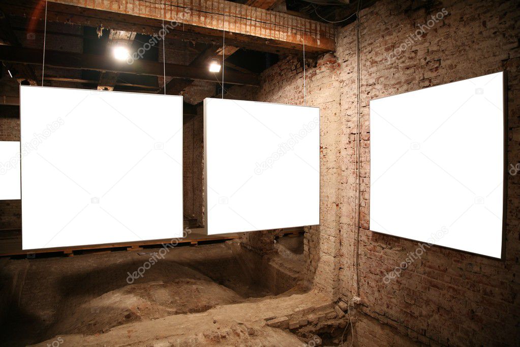 White frames on the brick wall