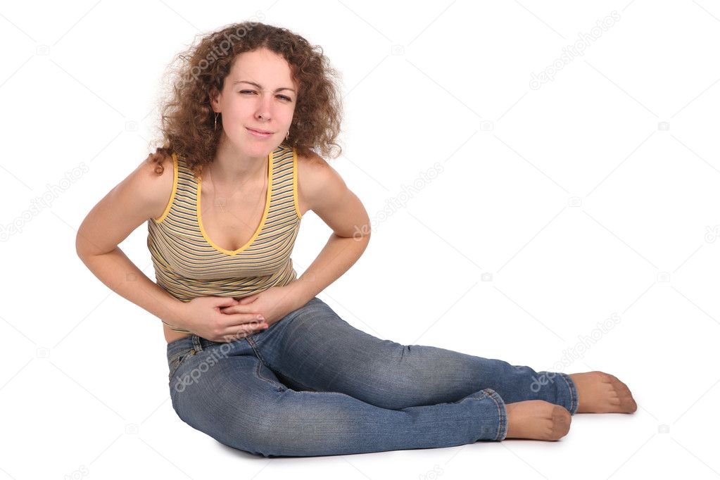 The young beautiful woman, in whom it hurt the stomach isolated on white