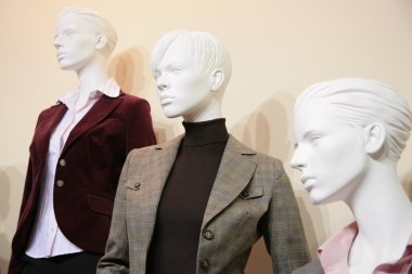 Three mannequins in jackets clipart