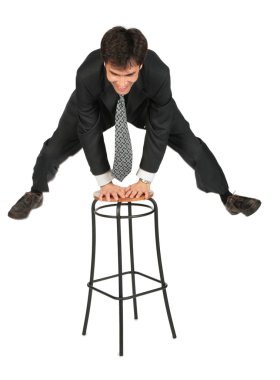 Businessman jumps above stool clipart