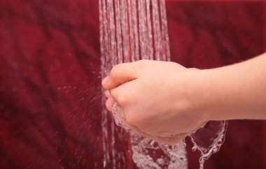 Hands under water jets from shower clipart