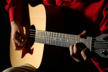 Close-up hands with guitar clipart