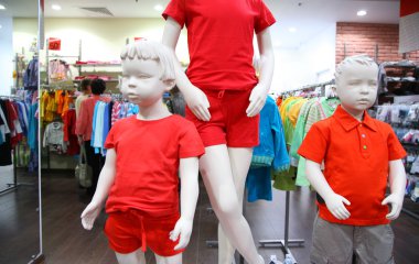 Child mannequins in store clipart