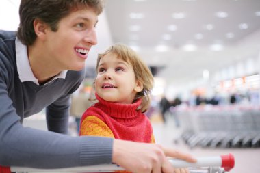 Father and daughter in shop clipart