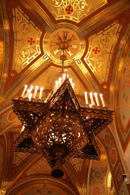 Chandelier under dome of Temple of Christ of Savior in Moscow clipart