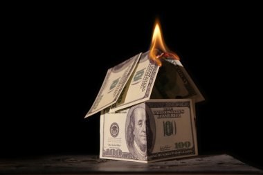 Burning house of dollars clipart