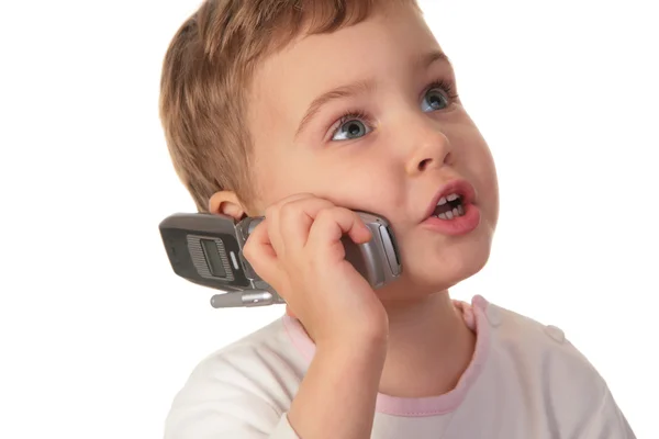 Bambina parlare sul cellulare su bianco — Foto Stock