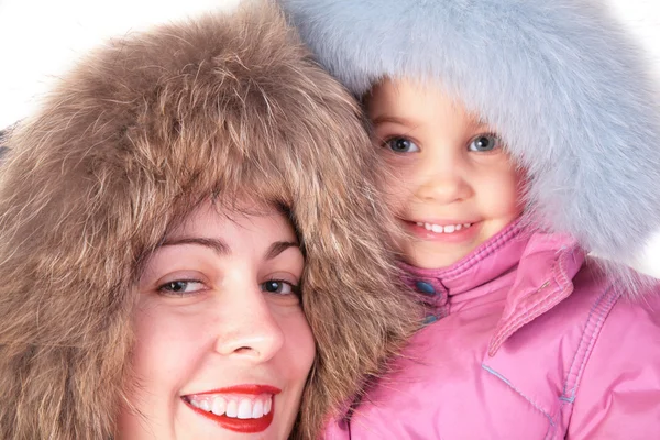 Mother with child in furry hats — Stock Photo, Image