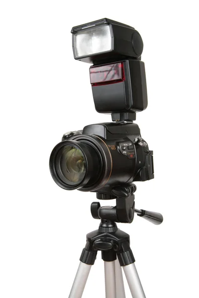 Modern photo camera with flash on tripod — Stock Photo, Image