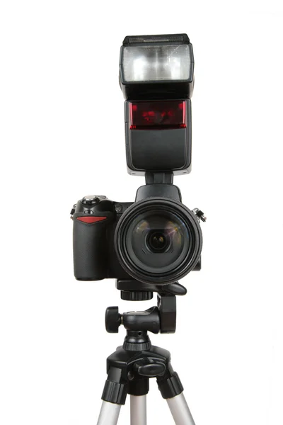 Modern photo camera with flash on tripod — Stock Photo, Image