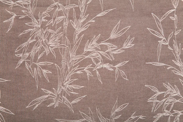Plant tekenen op bruin textiel textuur — Stockfoto
