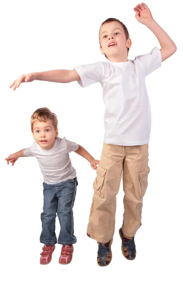 Jongen en meisje springen — Stockfoto
