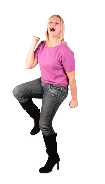 Happy middleaged woman in pink shirt stands dancing — Stock Photo, Image