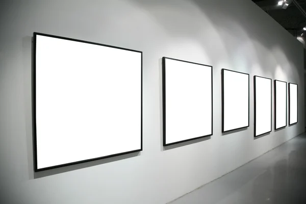 Frames on white wall — Stock Photo, Image