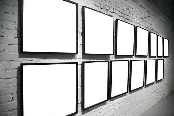 Two rows frames on brick white wall — Stock Photo, Image