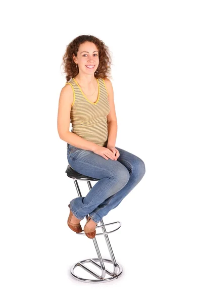 Jonge vrouw zitten op de balk kruk — Stockfoto