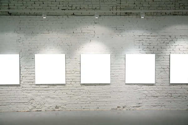Frames on brick wall — Stock Photo, Image