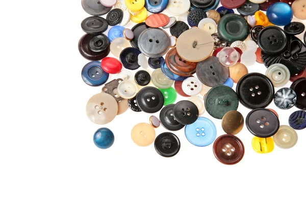 Muitos botões em heap no branco — Fotografia de Stock