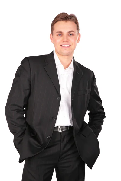 Young man in suit posing hands in pockets — Stock Photo, Image