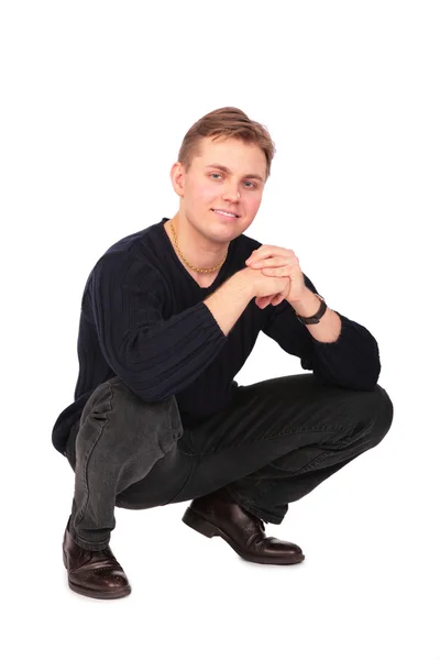 Mladý muž sedí na něčí stále drží — Stock fotografie