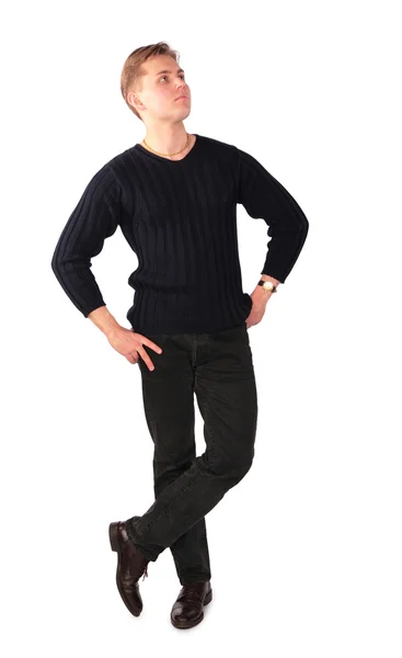 Young man stands cross legs — Stock Photo, Image