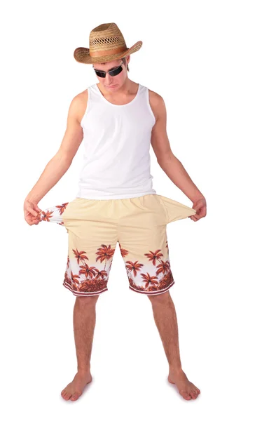 Hombre joven en pantalones cortos con bolsillos vacíos splay —  Fotos de Stock