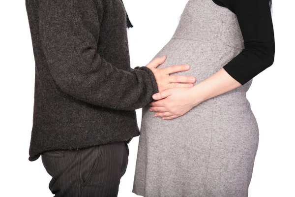 Pregnant couple in woolen dresses — Stock Photo, Image