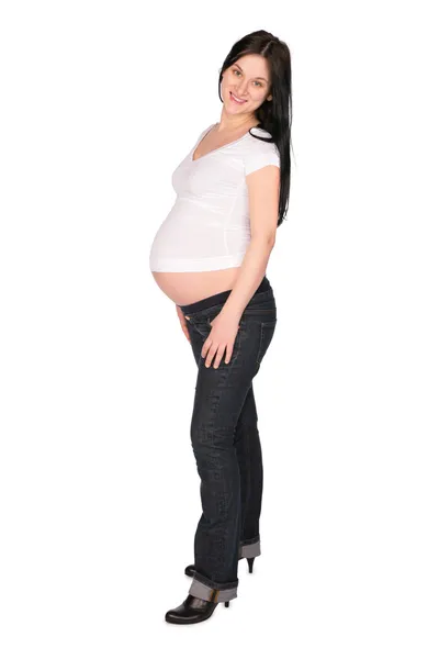 Беременная девушка позирует — стоковое фото