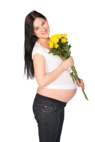 Έγκυος κοπέλα με λουλούδια — Φωτογραφία Αρχείου