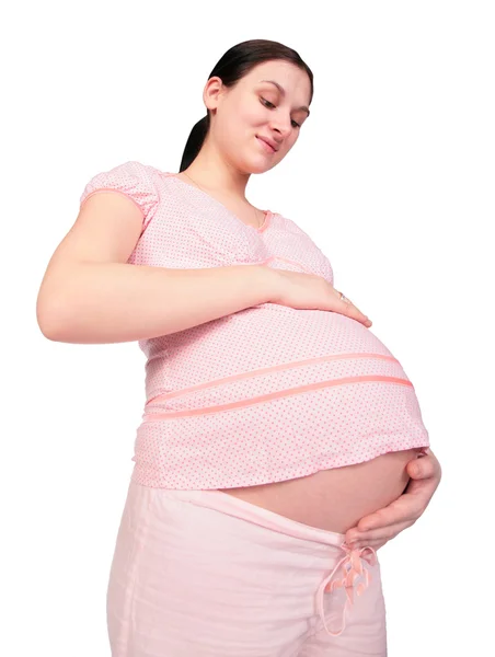 Беременная девочка касается живота — стоковое фото