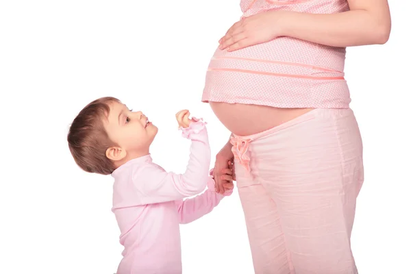 Маленькая девочка и беременная — стоковое фото