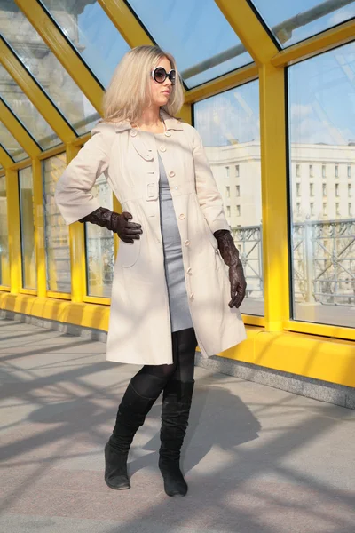 Young blonde in sunglasses and black gloves — Stock Photo, Image