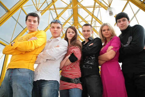 Group of young on footbridge view from below — Stock Photo, Image