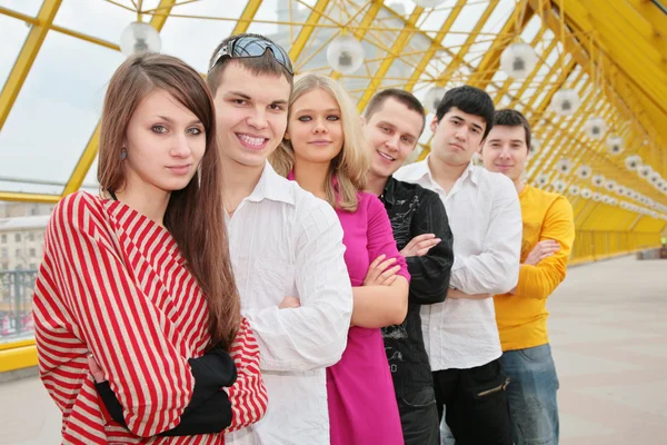 Group of young stand on footbridge — Stock Photo, Image